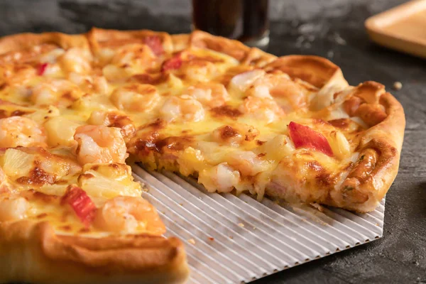 Close-up An appetizing pizza, piece of pizza cut out