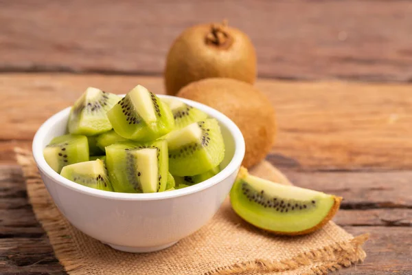 Slices Fresh Kiwis White Bowl Placed Old Wooden Table — Stock Photo, Image