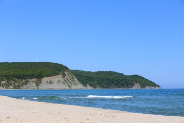Black sea and green hills and mountains