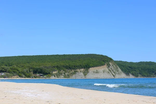 Black sea and green hills and mountains