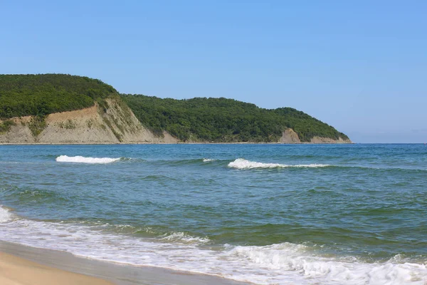 Black sea and green hills and mountains