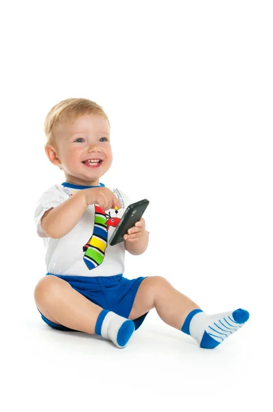 Gelukkig baby met mobiele telefoon Stockfoto