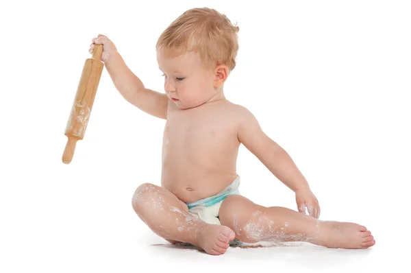 Little boy cooking with rolling pin — Stock Photo, Image