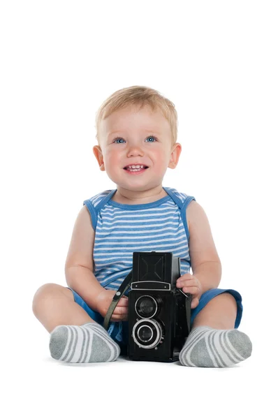 Mooie kleine jongen met oude filmcamera — Stockfoto