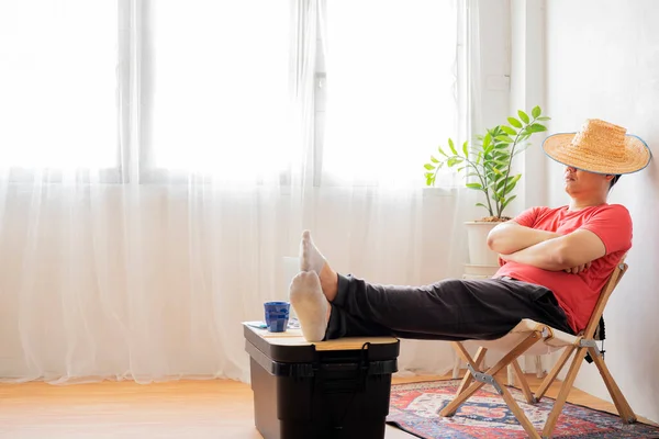 Men relax at home, at work, at work, napping or daydreaming. Happy relaxed Caucasian young male rest in chair distracted from computer work, relieve negative emotions.