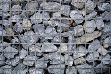 Taş bir duvarın dokusu. Eski kale taşından duvar dokusu. Arka plan ya da doku olarak taş duvar. Bir taş duvarın parçası, arkaplan veya doku için.