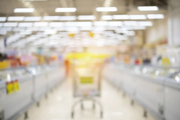 Abstrakte Verschwommene Supermarkt Gang Und Regale Hintergrund Supermarkt Einkaufswagen — Stockfoto