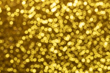 Bokeh odaklı ışıklarla altın soyut arkaplan