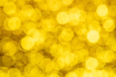 Bokeh odaklı olmayan ışıklarla altın soyut arka plan. Parlak bokeh ışıklarıyla soyut altın arkaplan.