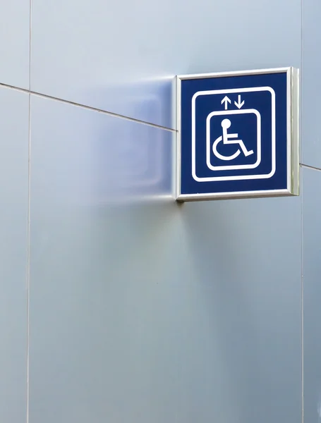 Blue Handicap Elevator Sign on Metallic Wall with Copy space — Stock Photo, Image