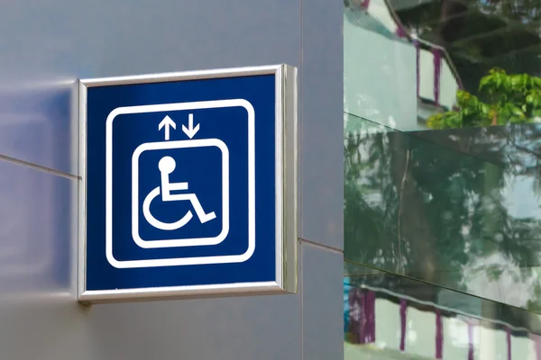 Blue Handicap Elevator Sign with Blurred Glass Background, Closeup — Stock Photo, Image