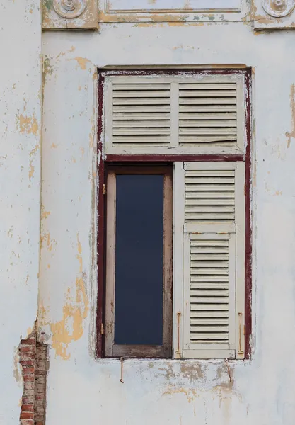 Abandoned White Wooden Window on Old White Wall