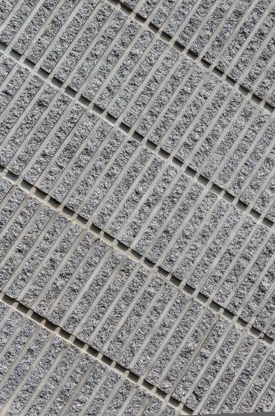Sfondo di cemento ondulato che mostra il modello di linee diagonali — Foto Stock