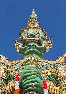 Green guardian statue at the Temple of Dawn, Thailand clipart
