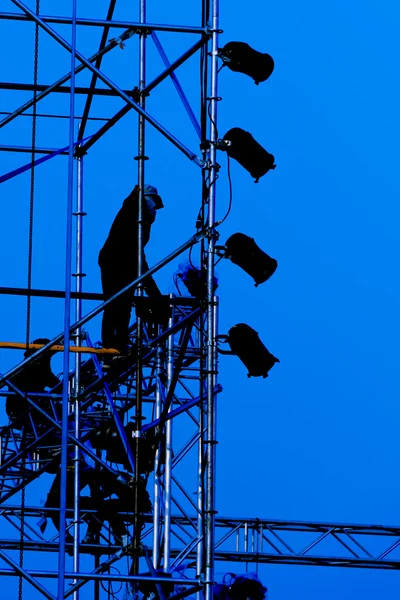 Silhouette of Workers in Blue Background — Stock Photo, Image