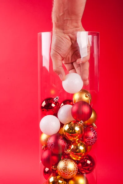 Christmas vase wearing a cristmas boll hand — Stock Photo, Image