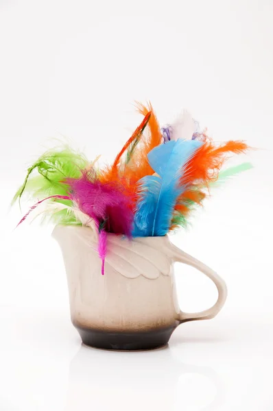 Container with feathers — Stock Photo, Image