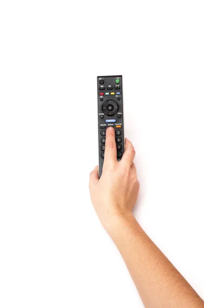 Рука тримає пульт дистанційного керування телевізором — стокове фото