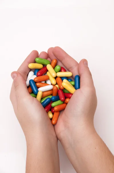 Руки полный конфеты — стоковое фото