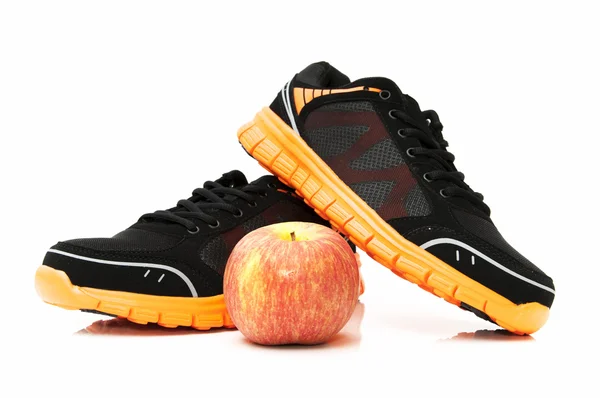 Chaussure noire avec pomme — Photo