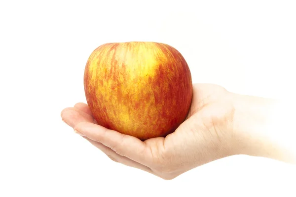 Main avec une pomme — Photo