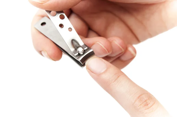 Cutting his finger nails — Stock Photo, Image