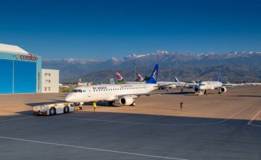 various transport aircrafts in public airport on sunny day