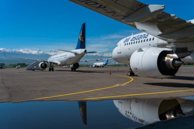 air astana company transport aircrafts in public airport on sunny day