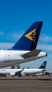 air astana company transport aircrafts in public airport on sunny day