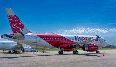 fly arystan transport aircraft in public airport on sunny day