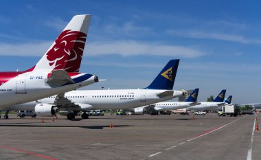 various transport aircrafts in public airport on sunny day