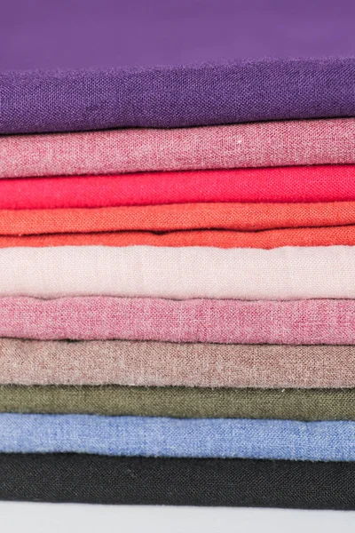 Closeup view of pile of colorful cotton fabric — Stock Photo, Image