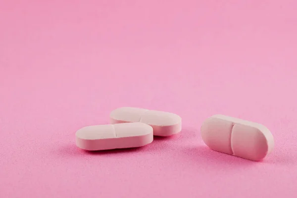 Pembe arka planda pembe haplar. Kadın sağlığı