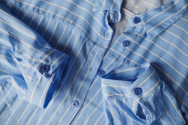 Woman blue striped cotton shirt for summer vacation
