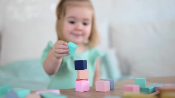 Adorable Little Girl Playing Colorful Wooden Cubes Focus Cubes — ストック動画