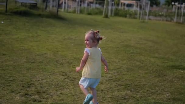 Happy Toddler Girl Running Away Looking Back Happy Active Childhood — Stockvideo