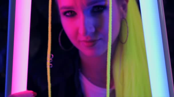 Portrait Millennial Young Woman Yellow Hair Holds Pink Blue Neon — Video Stock