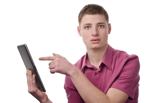 Young man pointing to a tablet. — Stock Photo, Image