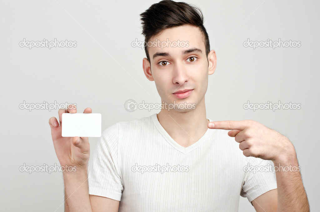 Man holding business card.