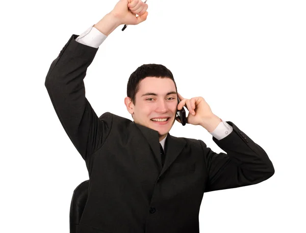 Homem de negócios com mão para cima alegre falando ao telefone . — Fotografia de Stock