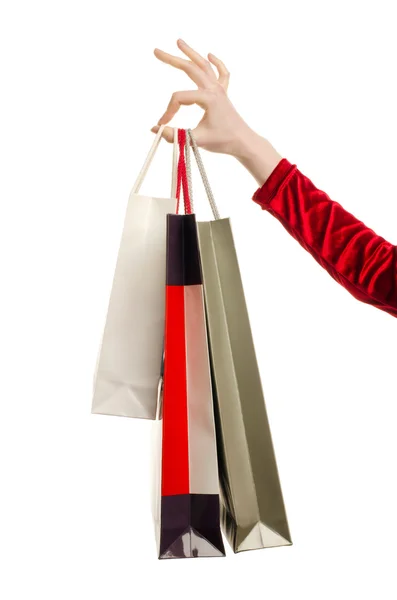 Female hand holding shopping bags. — Stock Photo, Image