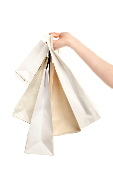 Vrouwelijke hand bedrijf shopping tassen. — Stockfoto