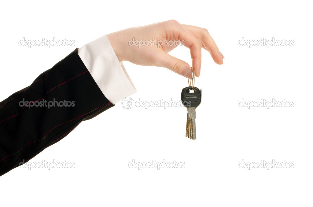 Hand holding keys.