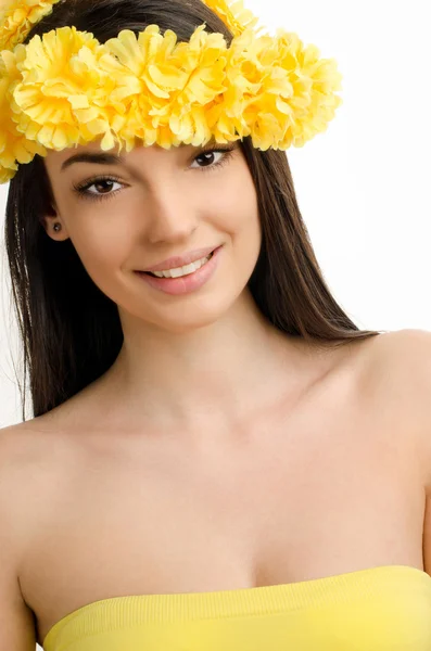 Portrait of a sexy woman with wreath of yellow flowers. — Stock Photo, Image