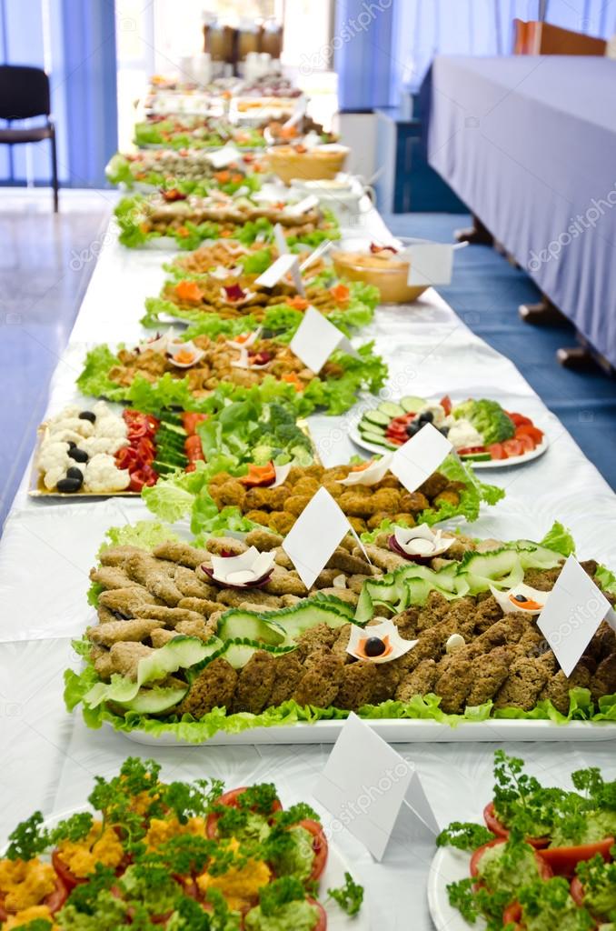Catering table full of appetizing foods.