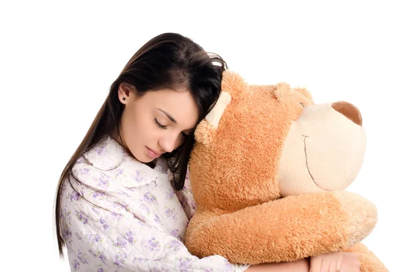 Chica durmiendo con un gran oso de peluche . —  Fotos de Stock