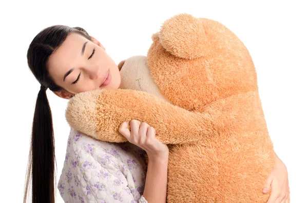 Meisje slapen met een grote teddybeer. — Stockfoto