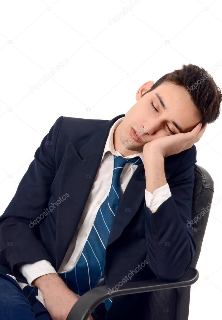 Young business man sleeping in the chair.