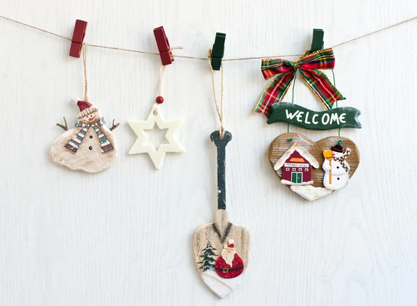 Christmas decorations hanging from a rope. — Stock Photo, Image