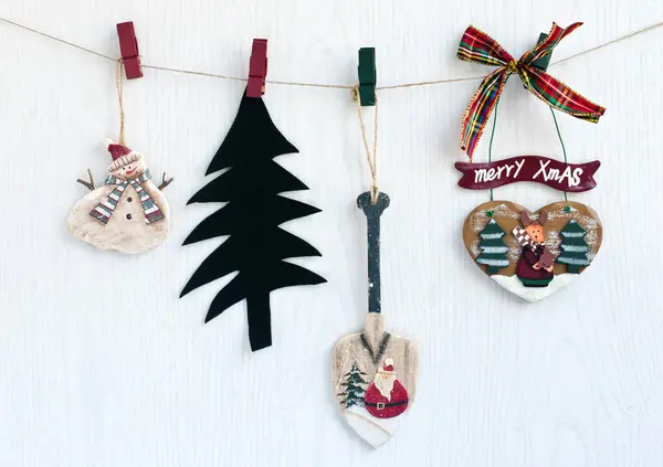 Christmas decorations hanging from a rope. — Stock Photo, Image